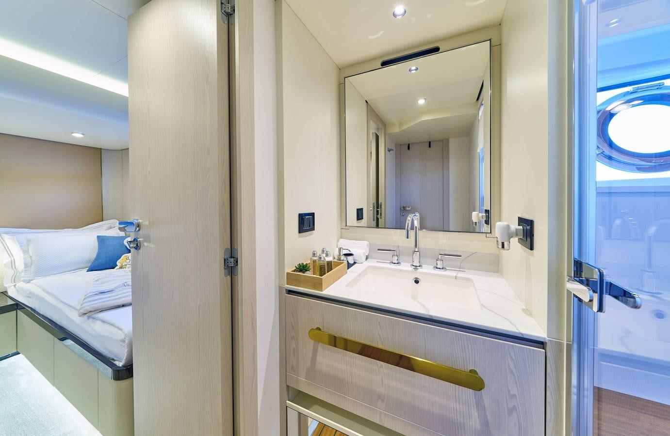 a bathroom with a sink and a mirror aboard VIVA Yacht for Sale