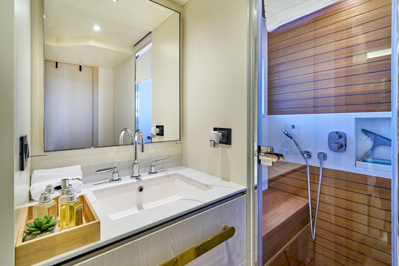 a bathroom with a sink and a mirror aboard VIVA Yacht for Sale
