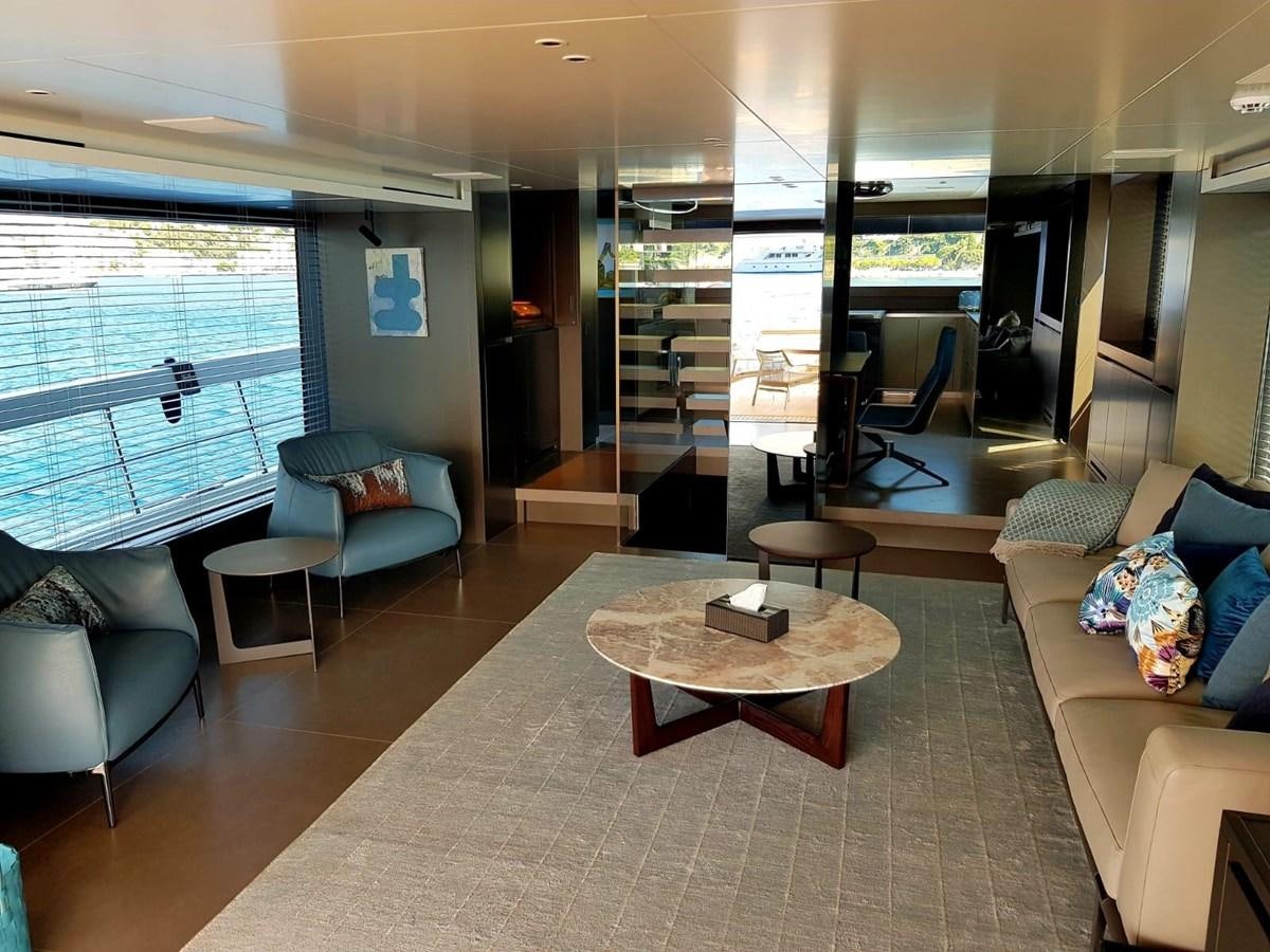 a living room with a glass wall aboard 2020 SANLORENZO SX88 #43 Yacht for Sale
