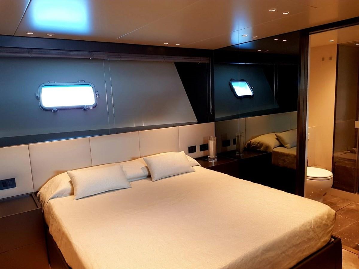 a room with a bed and a window aboard 2020 SANLORENZO SX88 #43 Yacht for Sale