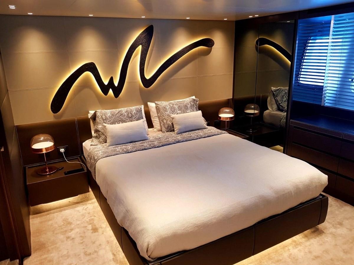 a bed with a large headboard aboard 2020 SANLORENZO SX88 #43 Yacht for Sale