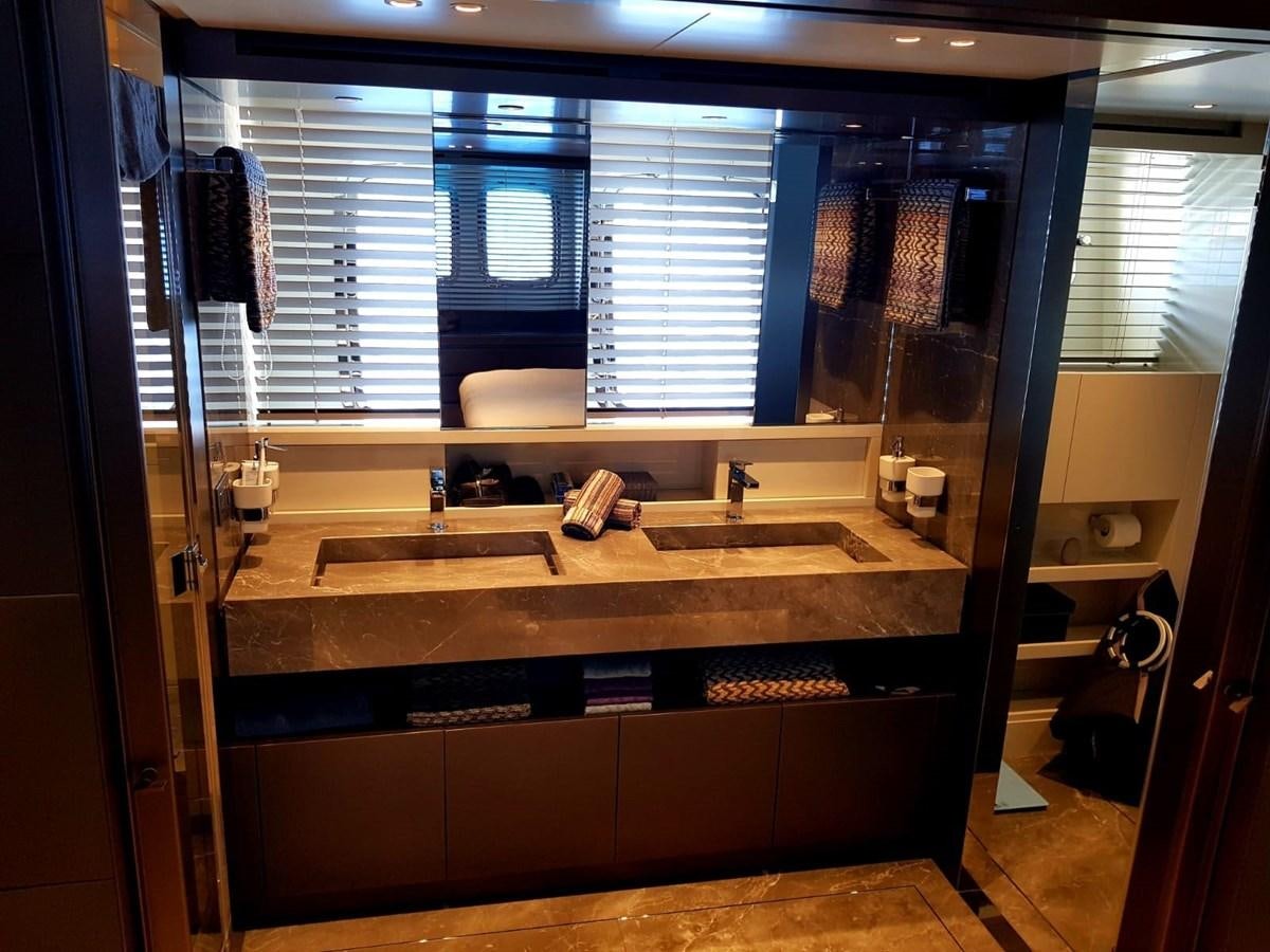 a bathroom with a sink and a mirror aboard 2020 SANLORENZO SX88 #43 Yacht for Sale
