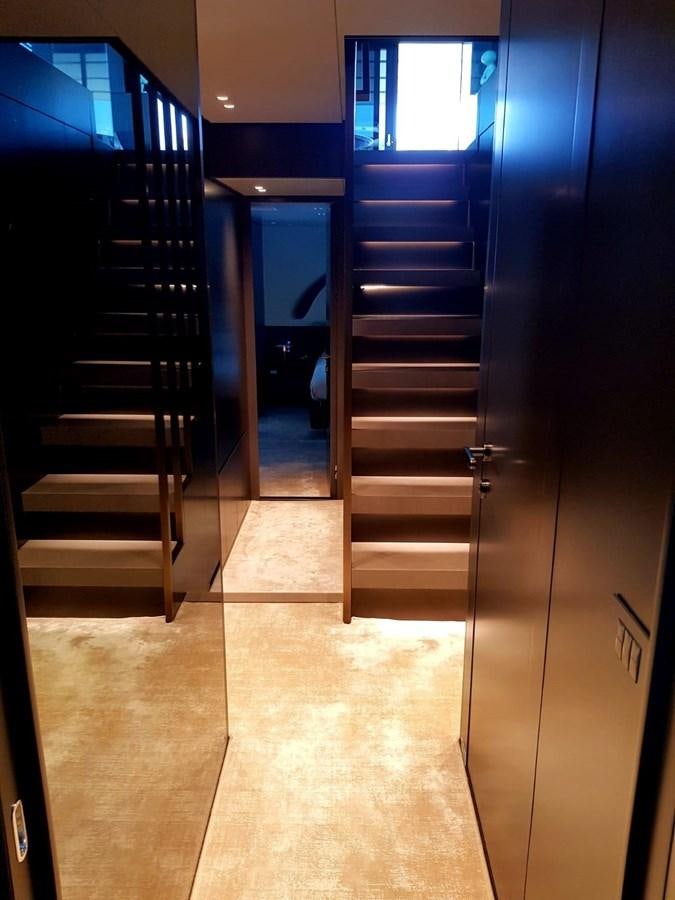 a hallway with a set of stairs aboard 2020 SANLORENZO SX88 #43 Yacht for Sale