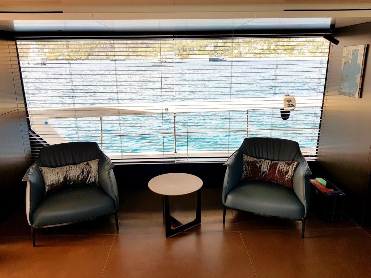a couple of chairs in a room aboard 2020 SANLORENZO SX88 #43 Yacht for Sale