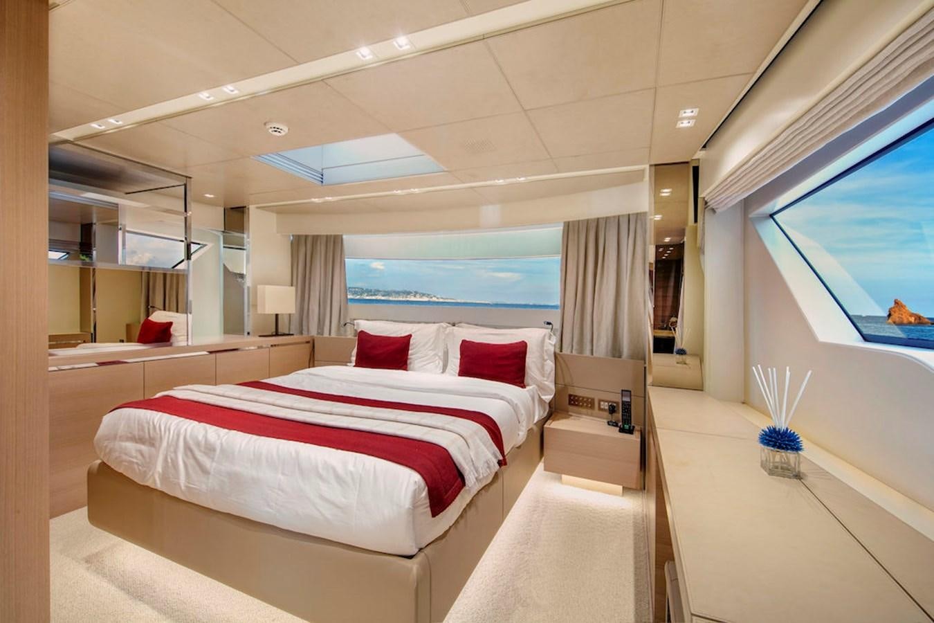 a room with a bed and a window aboard SX88 Yacht for Sale
