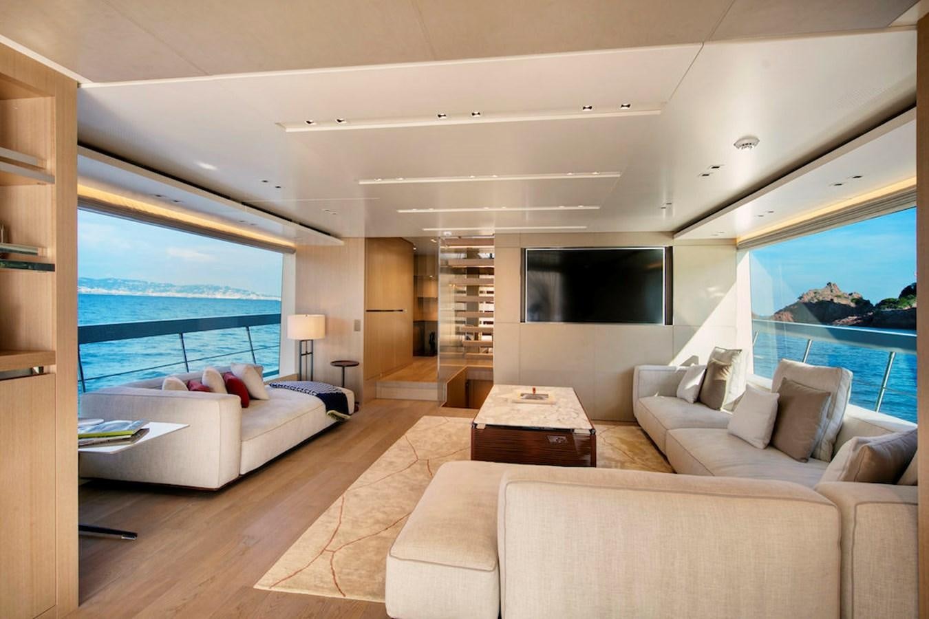 a living room with a large window aboard SX88 Yacht for Sale