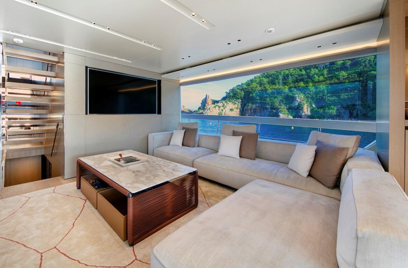 a living room with a couch and a table aboard SX88 Yacht for Sale