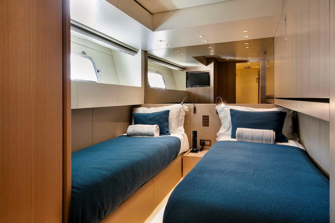 a couple of beds in a room aboard SX88 Yacht for Sale