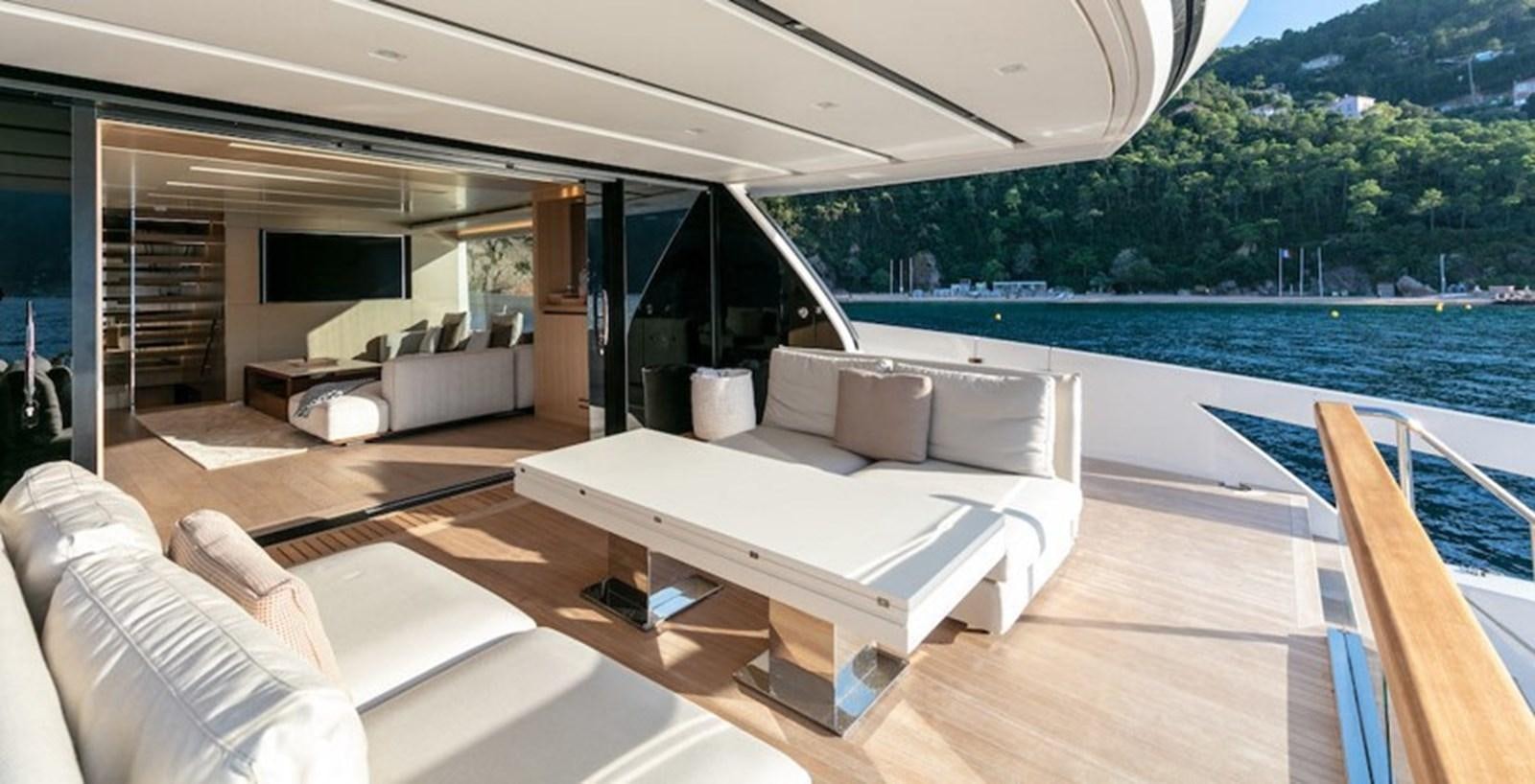 a room with a bed and a couch aboard SX88 Yacht for Sale
