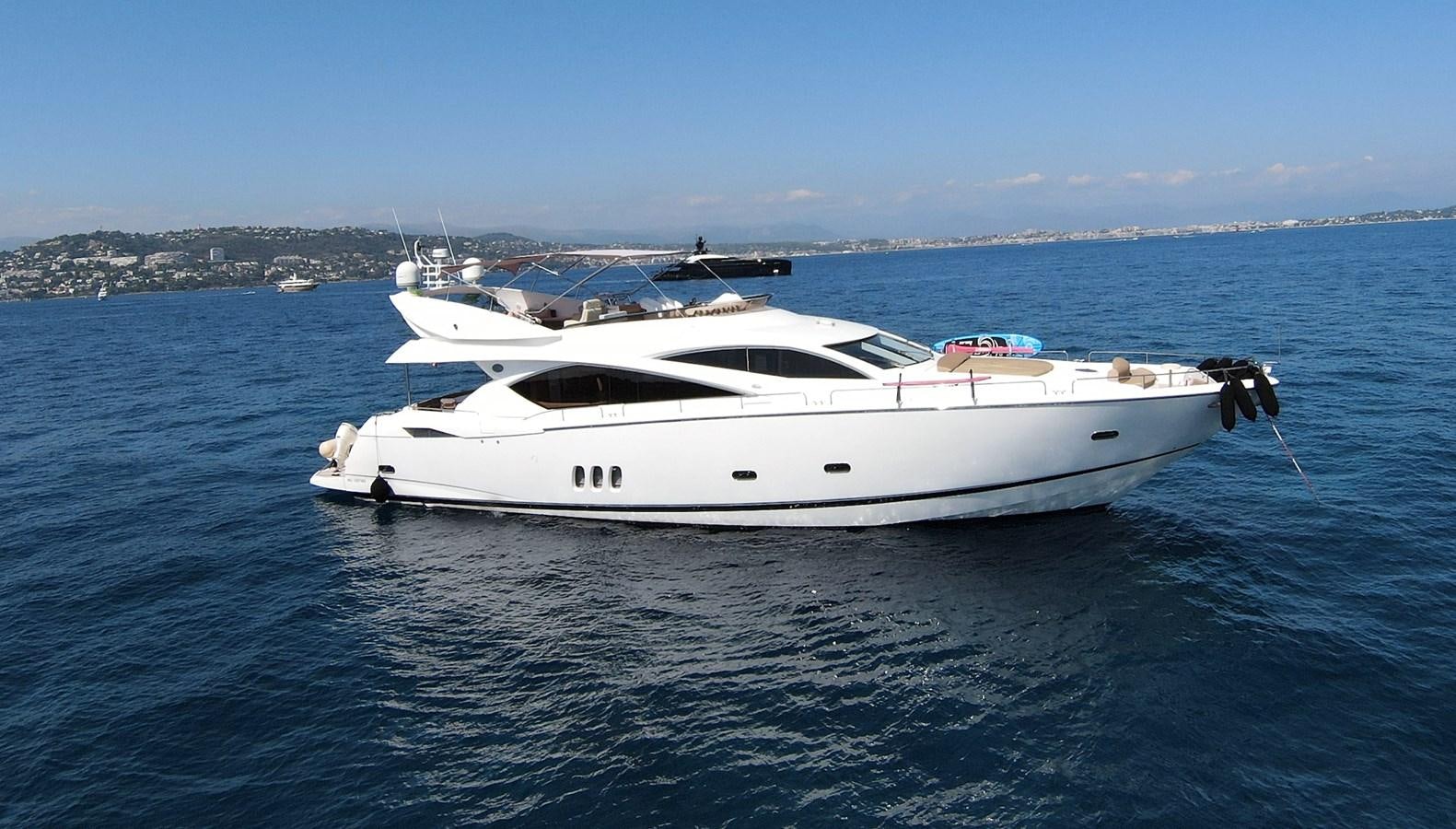 a white yacht in the water aboard TOFUN Yacht for Sale