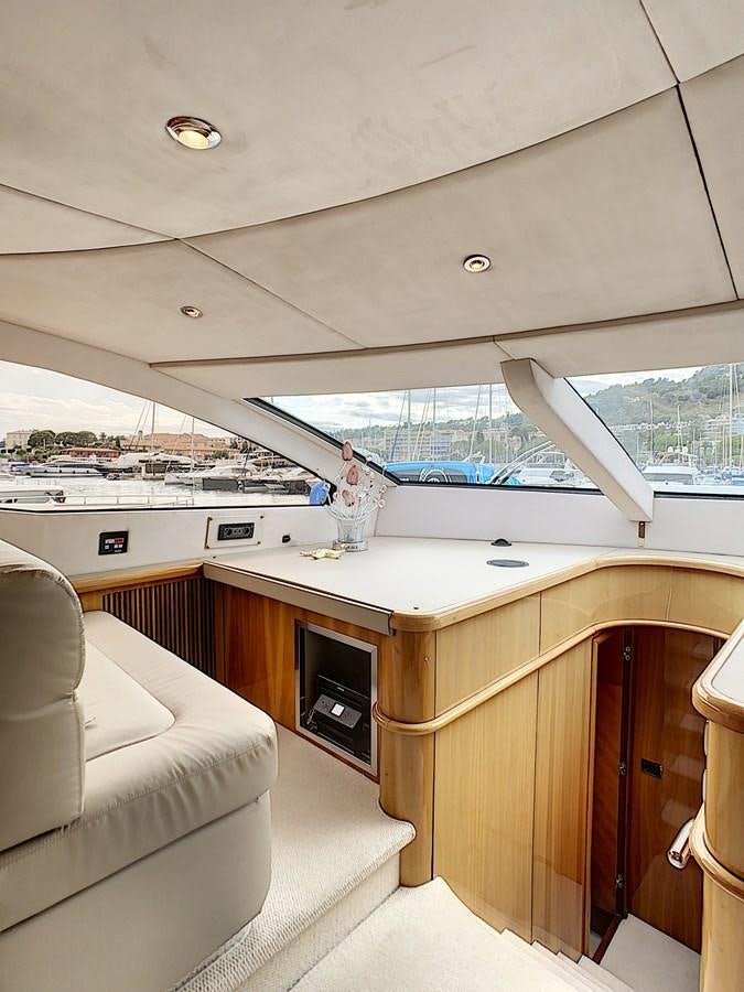 a room with a large window and a view of the water aboard TOFUN Yacht for Sale