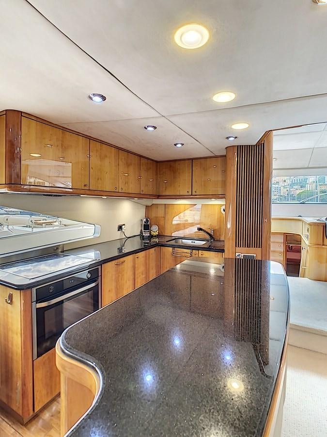 a kitchen with a large island aboard TOFUN Yacht for Sale