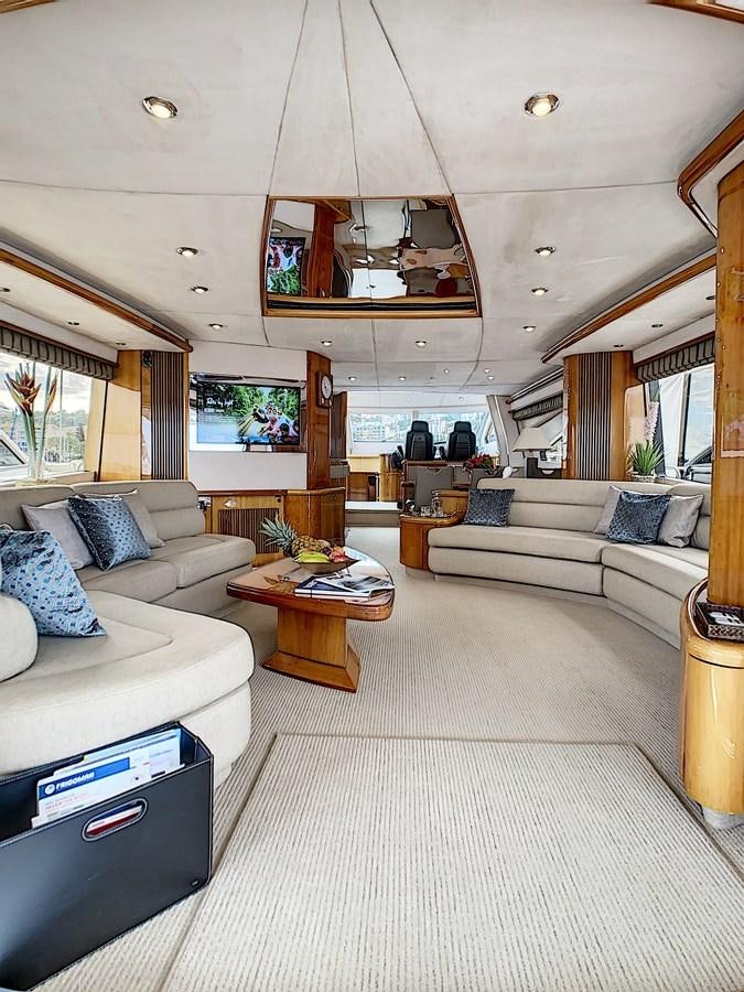 a living room with a large mirror aboard TOFUN Yacht for Sale