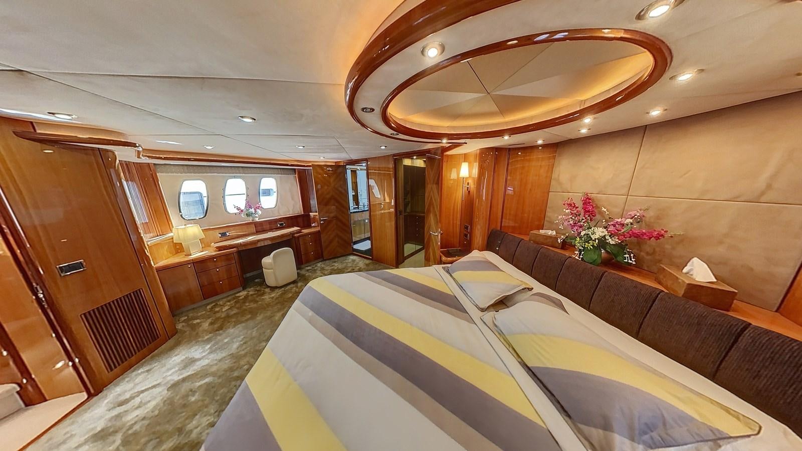 a room with a bed and a desk aboard TOFUN Yacht for Sale