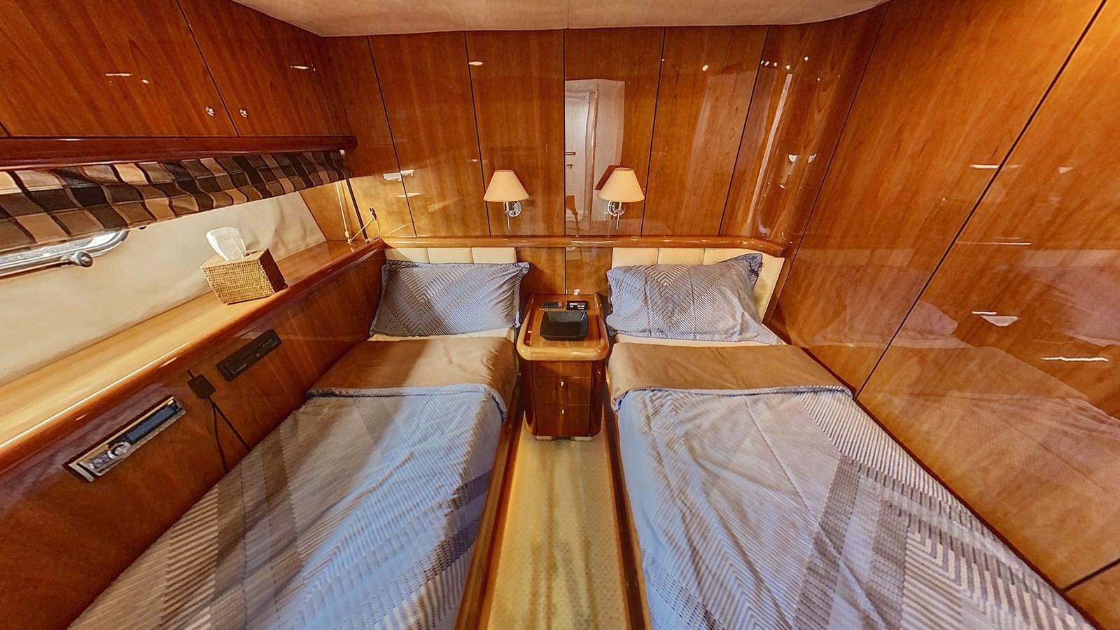 a room with two beds aboard TOFUN Yacht for Sale