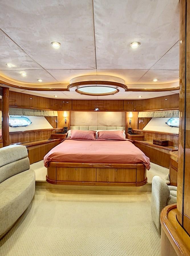 a large bedroom with a bed aboard TOFUN Yacht for Sale
