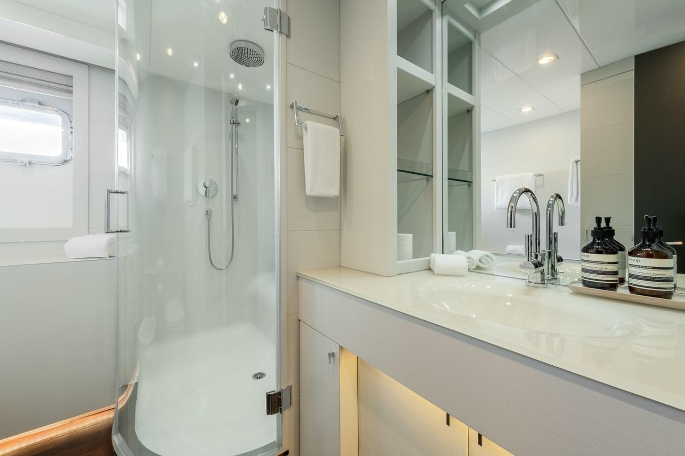 a bathroom with a glass shower aboard ZIA Yacht for Sale
