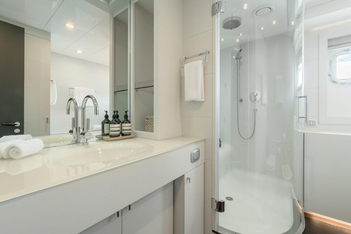 a bathroom with a shower and sink aboard ZIA Yacht for Sale