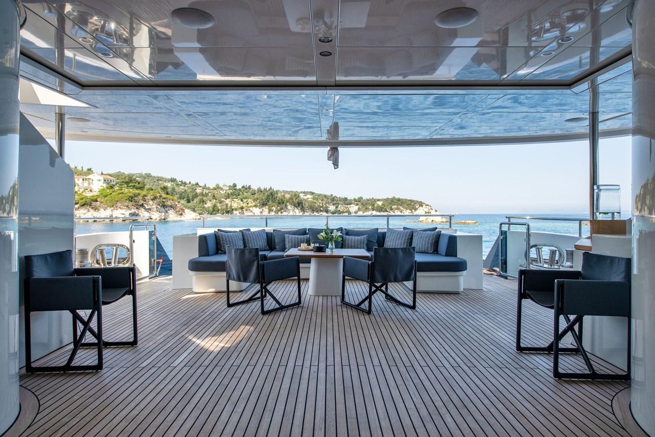a room with a table and chairs aboard ZIA Yacht for Sale