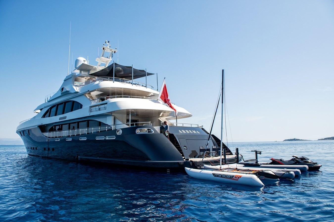 a boat with a flag on it aboard ZIA Yacht for Sale