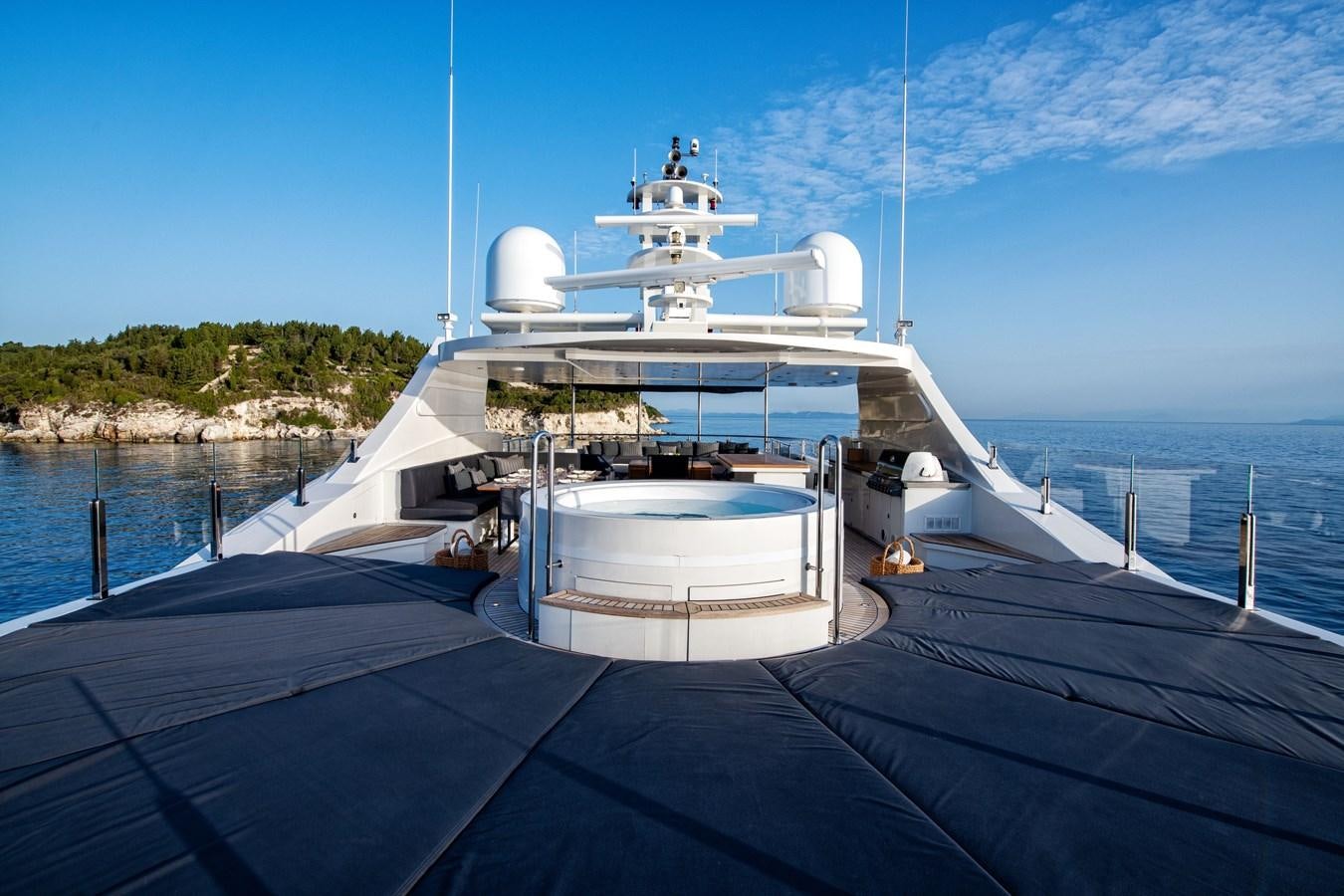 a large white boat on a dock aboard ZIA Yacht for Sale