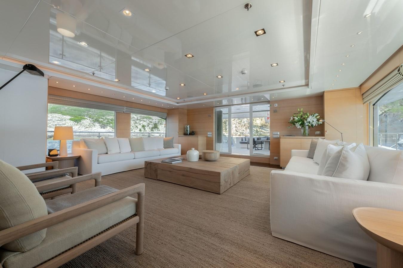 a living room with a large open window aboard ZIA Yacht for Sale