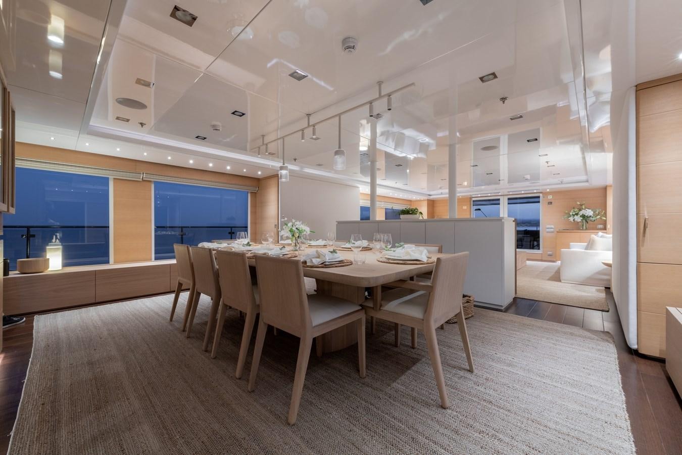 a room with a table and chairs aboard ZIA Yacht for Sale