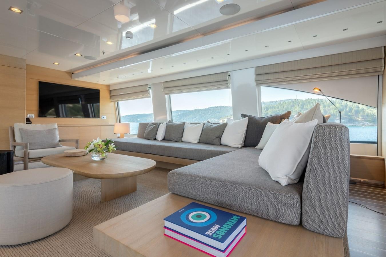 a living room with a couch and a table aboard ZIA Yacht for Sale