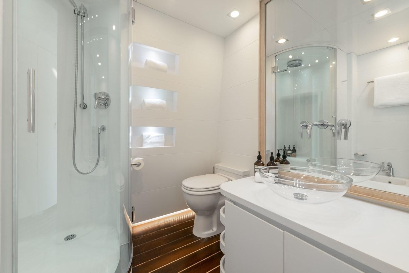 a bathroom with a glass shower aboard ZIA Yacht for Sale