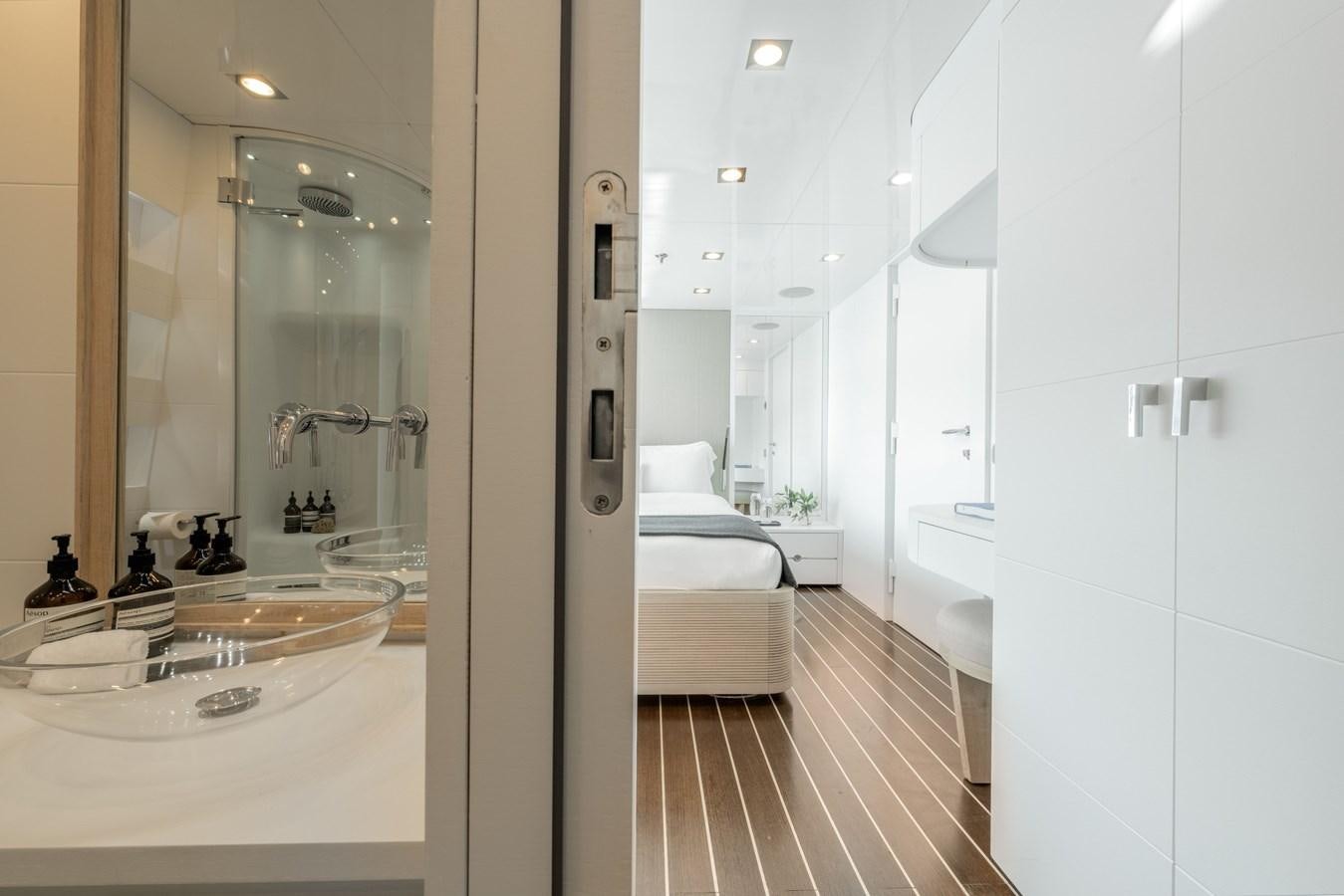 a bathroom with a large mirror aboard ZIA Yacht for Sale
