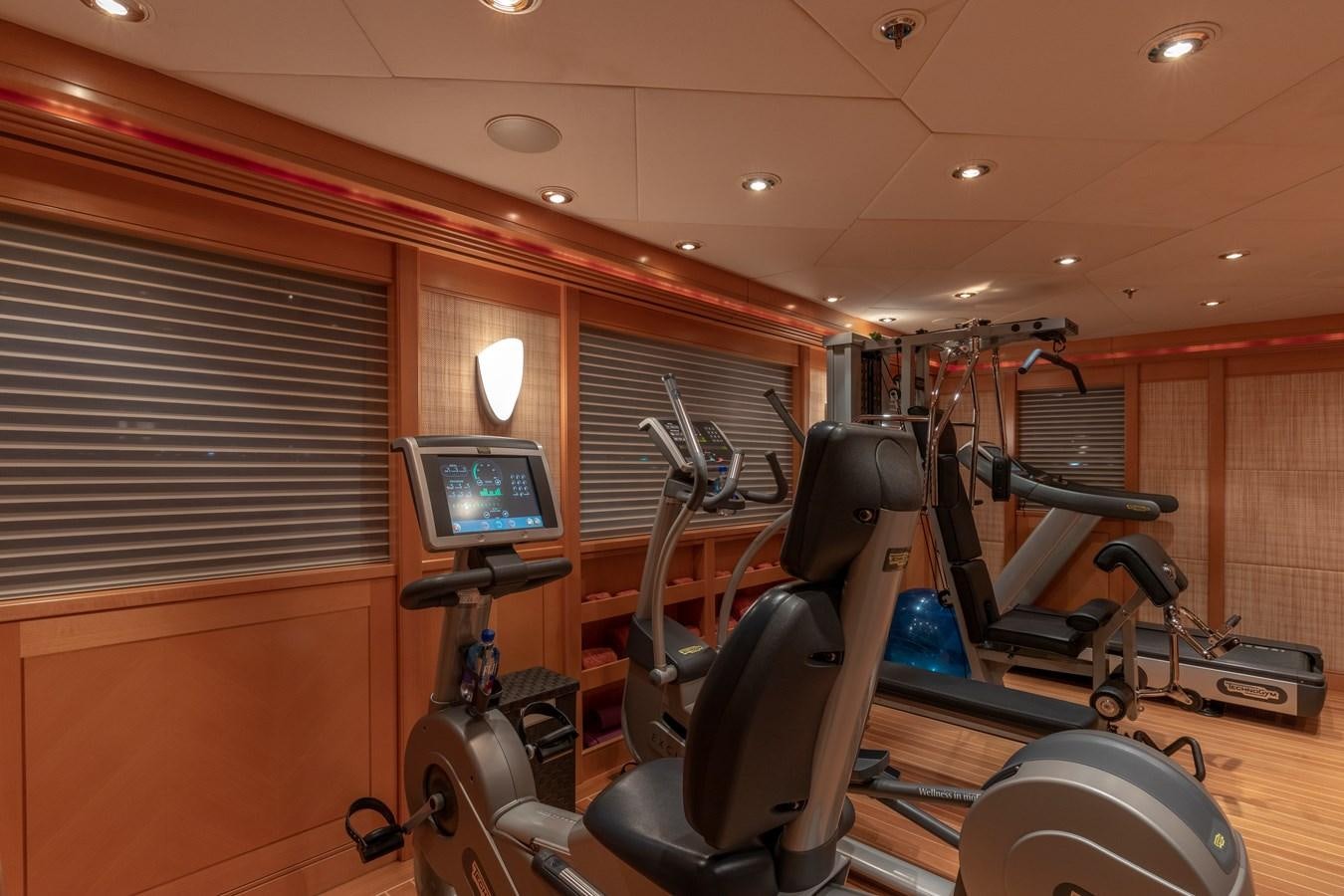 a room with a large mirror and a bike rack aboard LAUREL Yacht for Sale