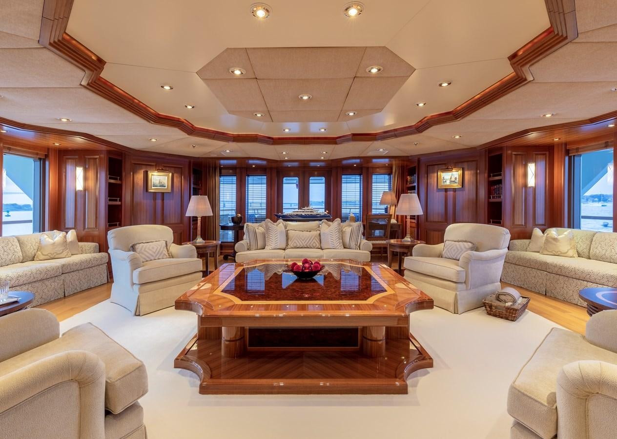 a living room with a large table aboard LAUREL Yacht for Sale