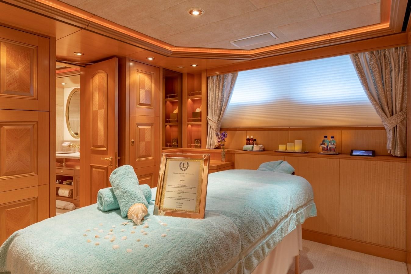 a bed in a room aboard LAUREL Yacht for Sale