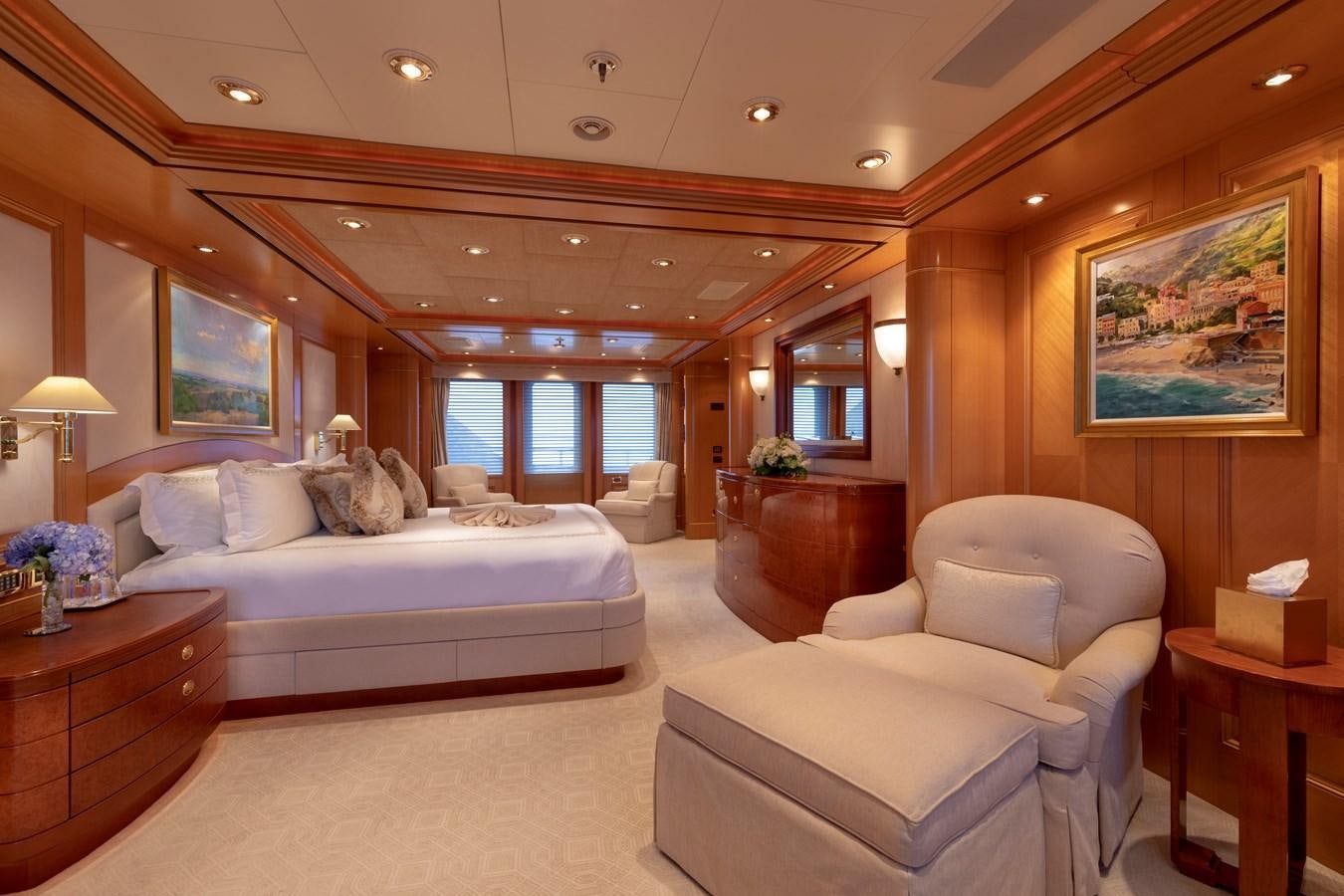 a large bedroom with a bed and a large window aboard LAUREL Yacht for Sale