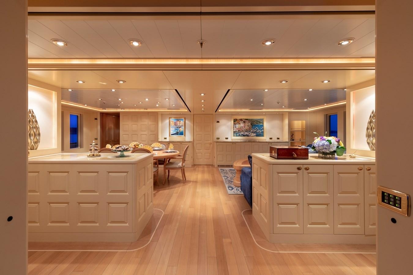 a large kitchen with white cabinets aboard LAUREL Yacht for Sale