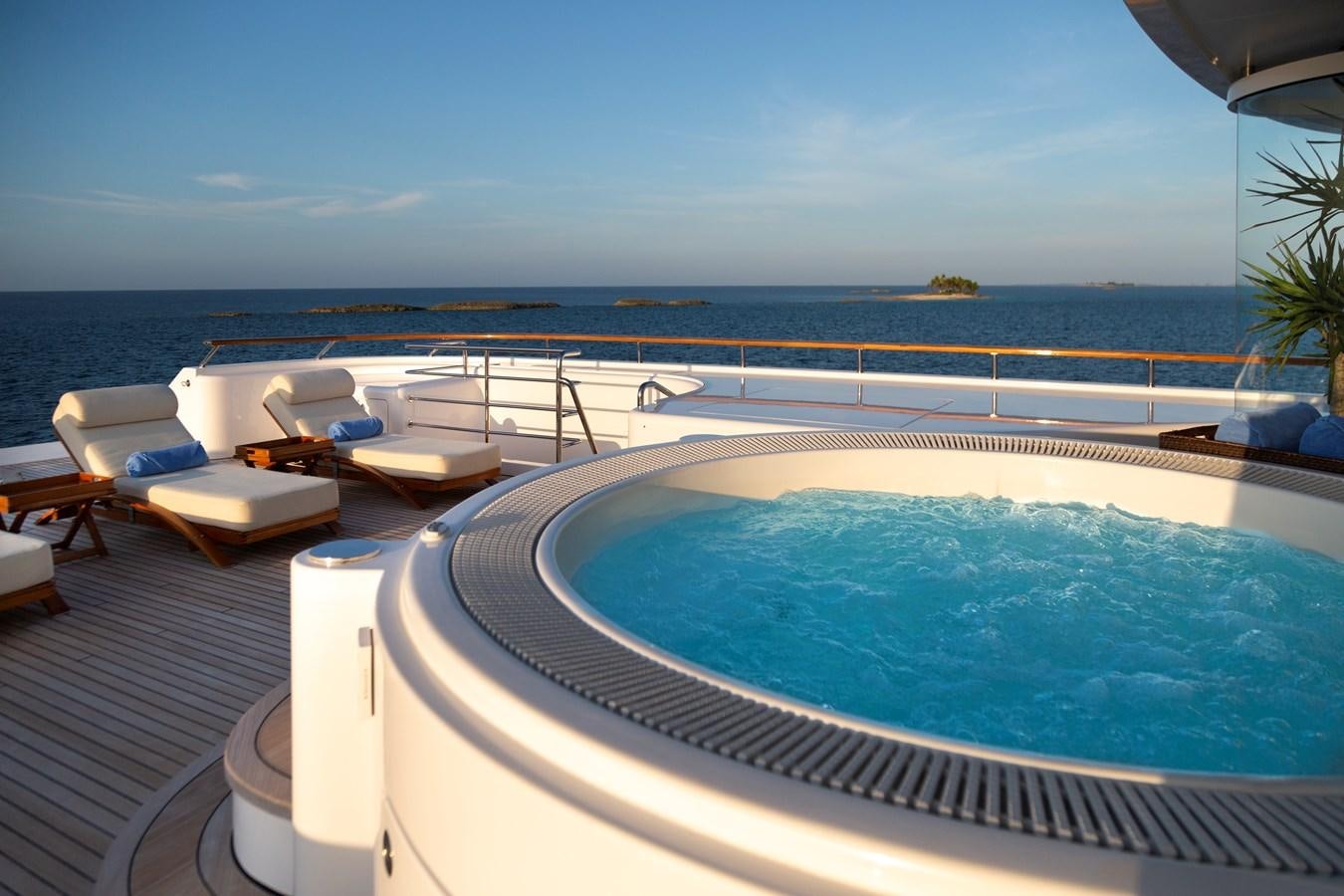 a swimming pool with a view of the ocean and the ocean aboard LAUREL Yacht for Sale