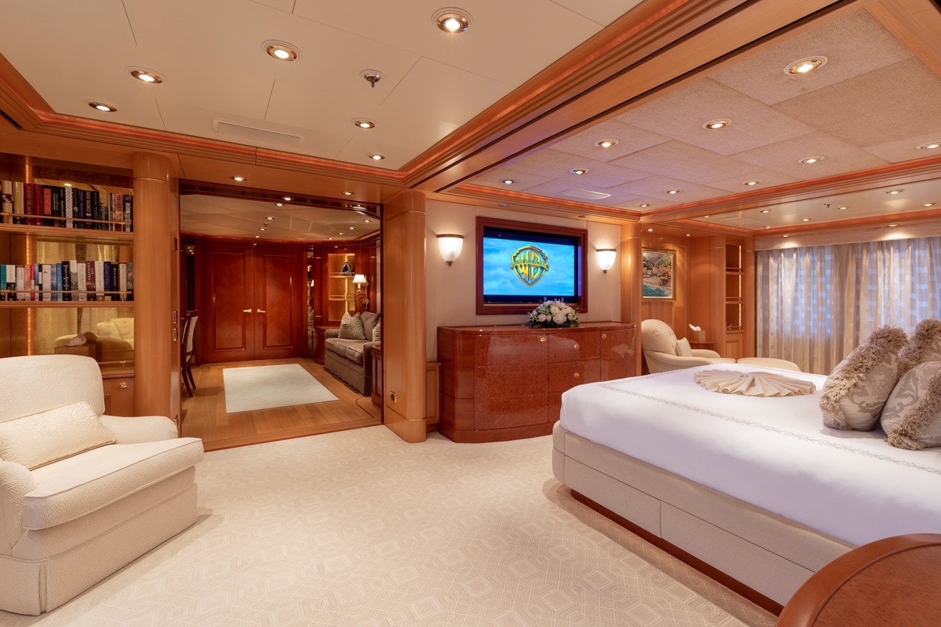 a room with a bed and a tv on the wall aboard LAUREL Yacht for Sale