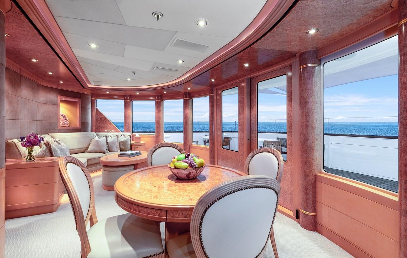 a room with a table and chairs aboard LAUREL Yacht for Sale
