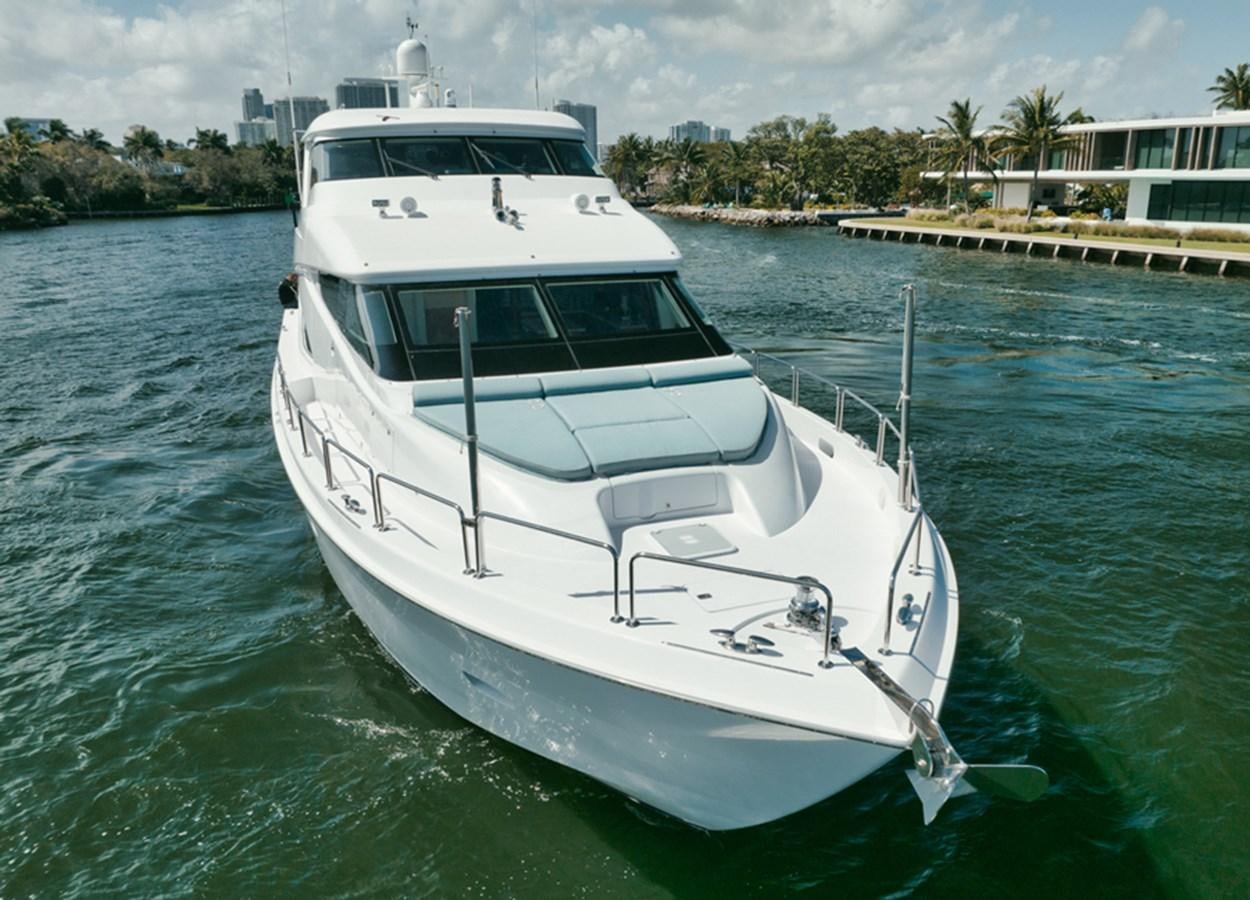 a white boat in the water aboard DONE DEAL Yacht for Sale