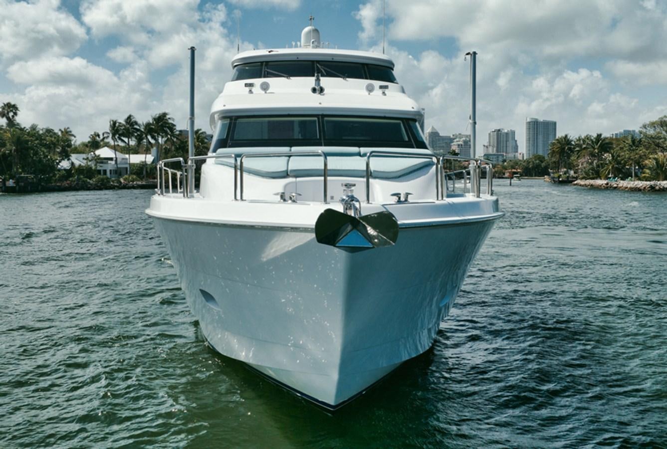 a large white boat in the water aboard DONE DEAL Yacht for Sale
