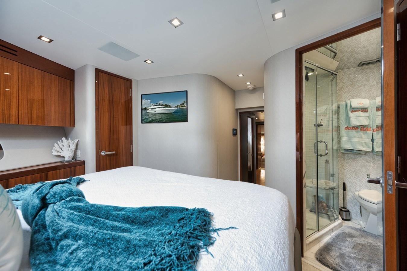 a bedroom with a large mirror aboard DONE DEAL Yacht for Sale