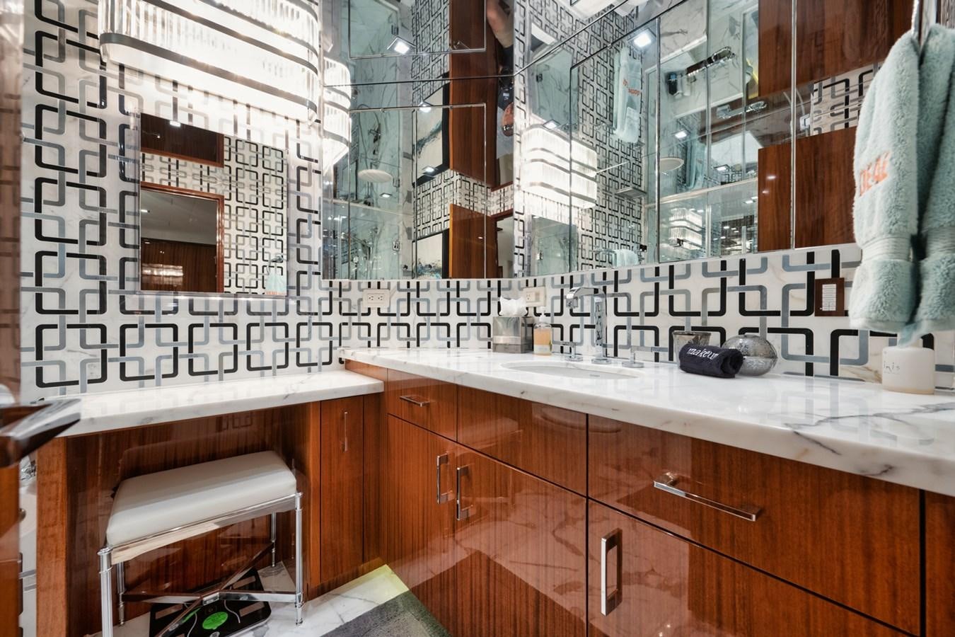 a bathroom with a sink and a mirror aboard DONE DEAL Yacht for Sale