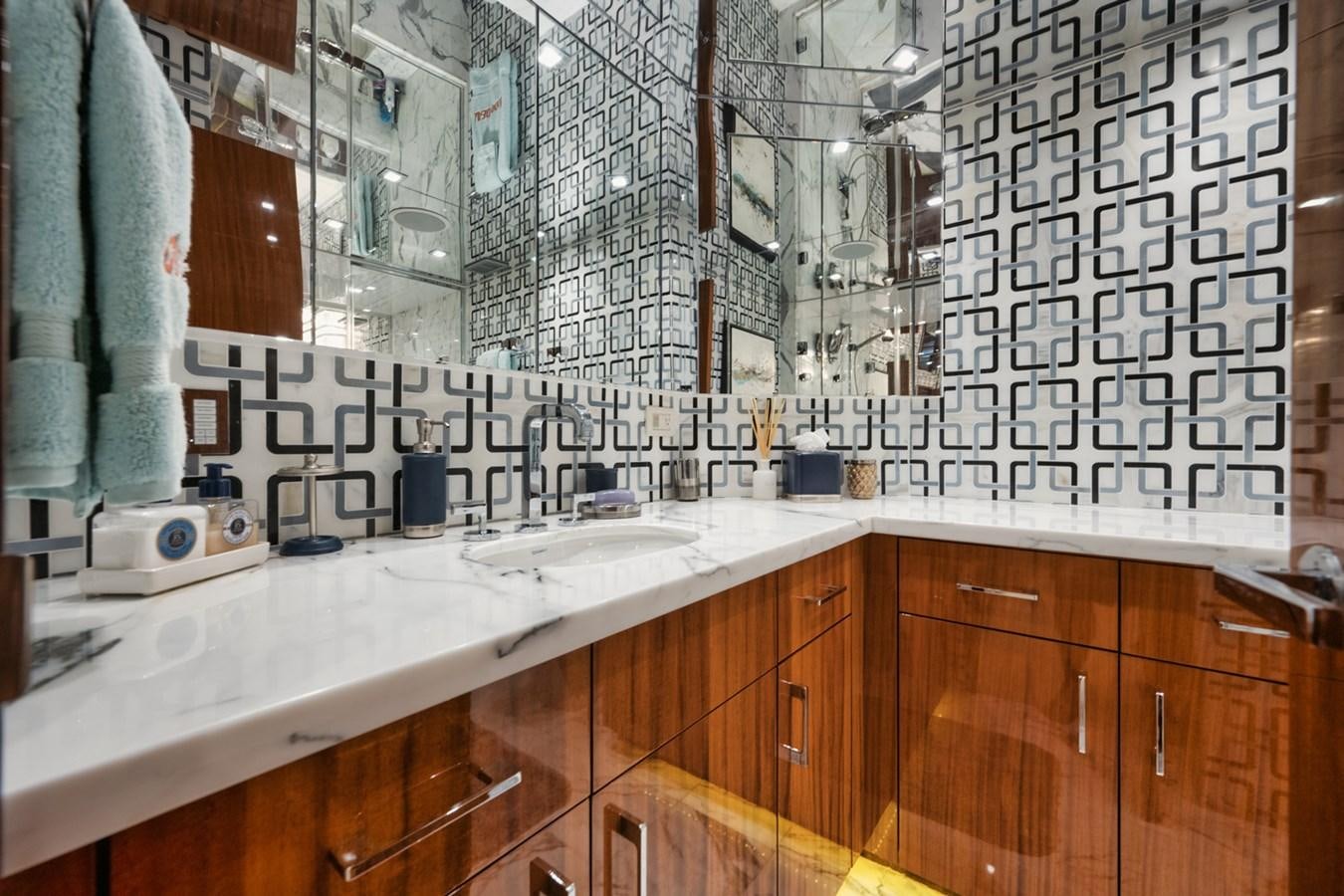 a bathroom with a sink and a mirror aboard DONE DEAL Yacht for Sale