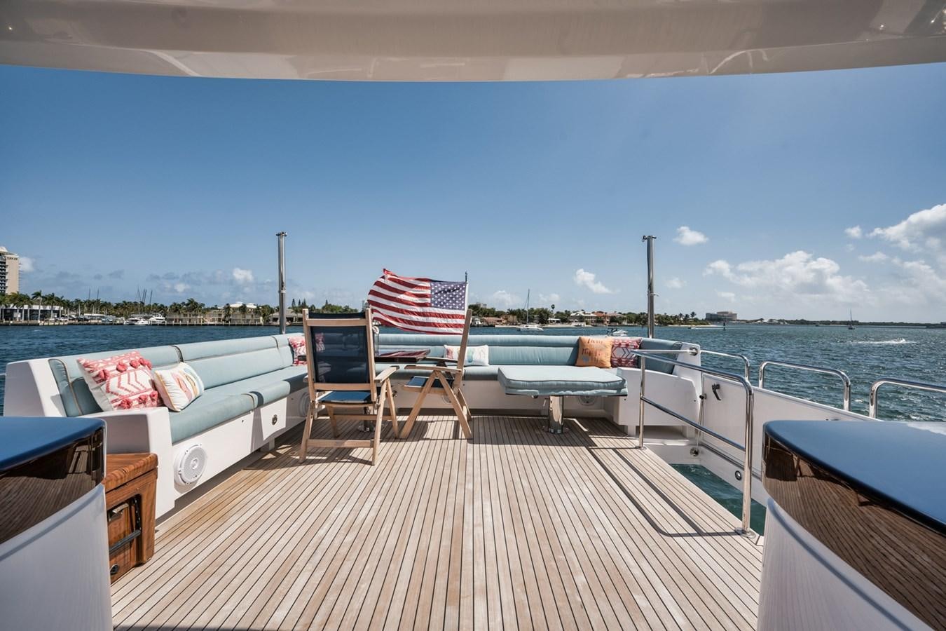 a deck with chairs and a table on it aboard DONE DEAL Yacht for Sale