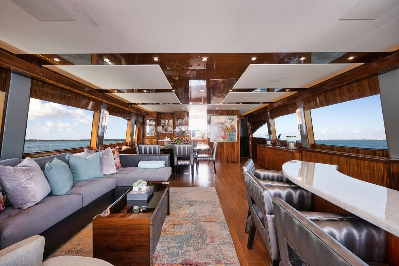 a living room with a couch and a table aboard DONE DEAL Yacht for Sale