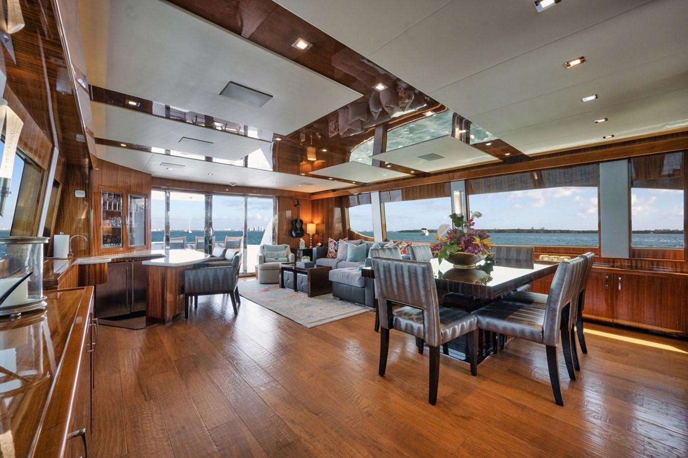 a large living room with a large glass window aboard DONE DEAL Yacht for Sale