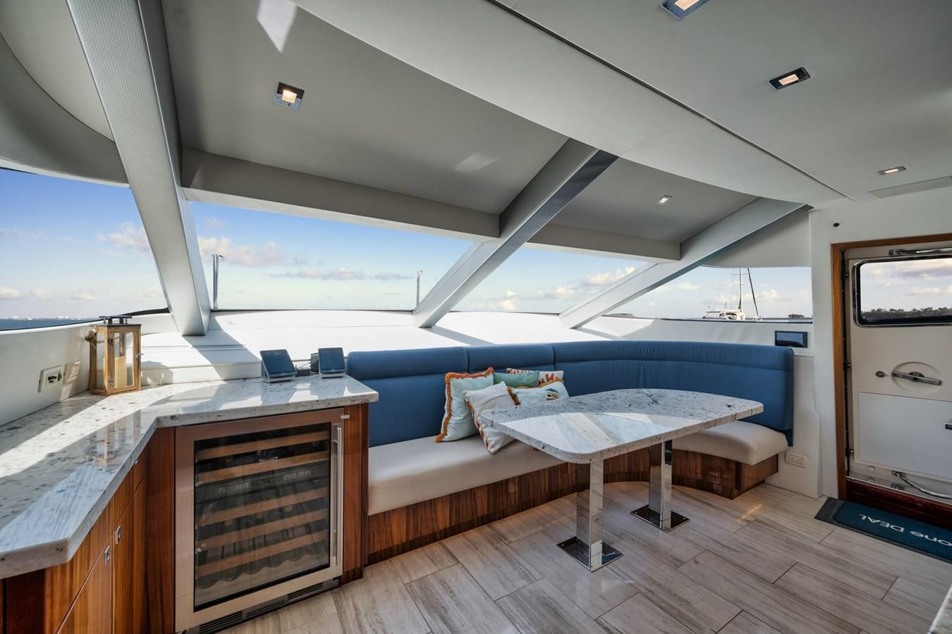 a room with a bed and a table aboard DONE DEAL Yacht for Sale