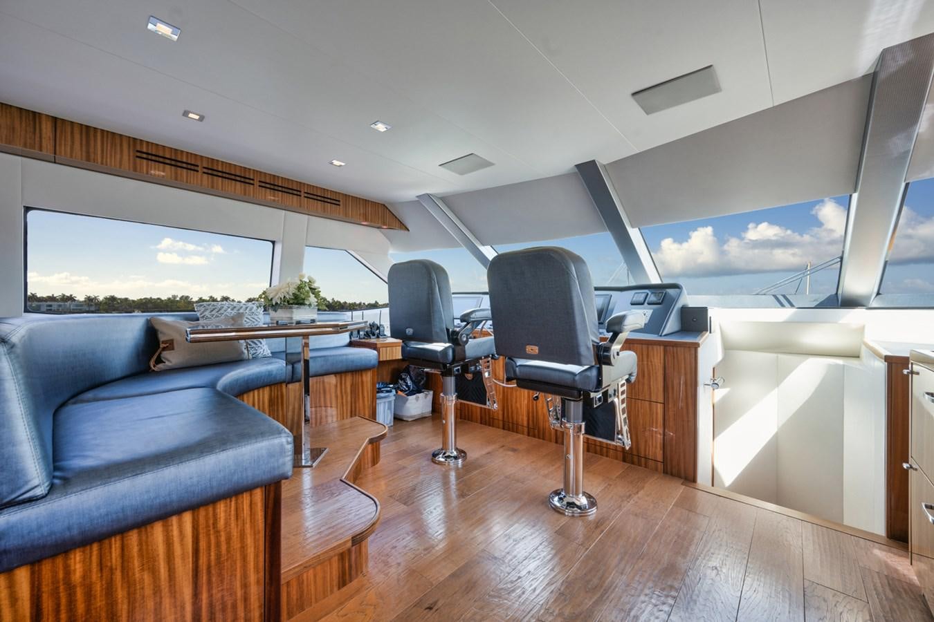 a room with a couch and a table and a tv aboard DONE DEAL Yacht for Sale