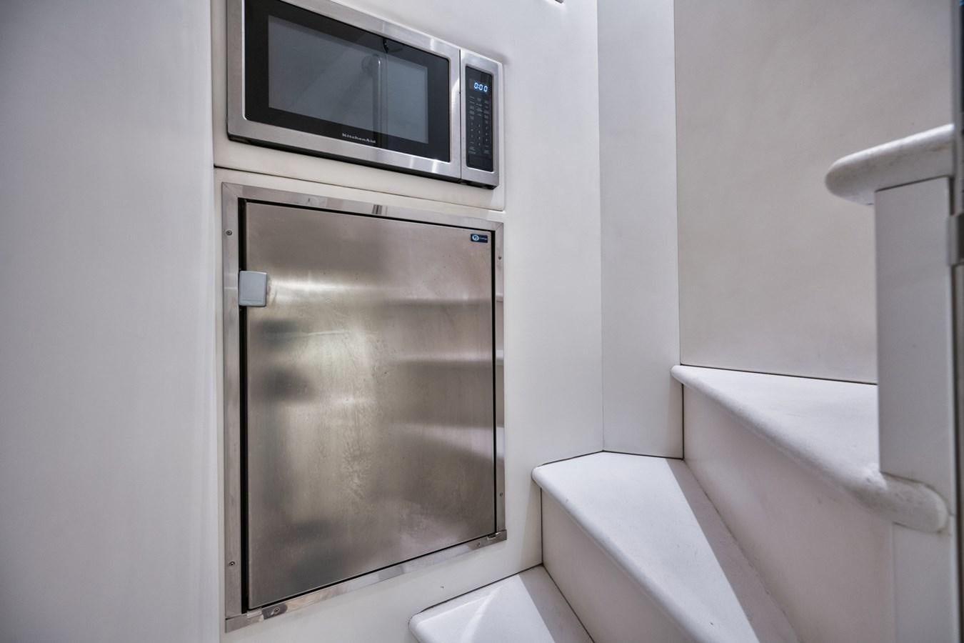 a microwave oven on a shelf aboard DONE DEAL Yacht for Sale