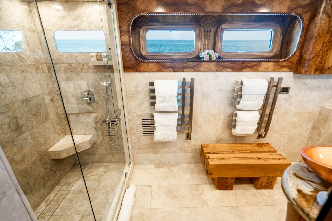 a bathroom with a sink and a mirror aboard DRAMA QUEEN Yacht for Sale